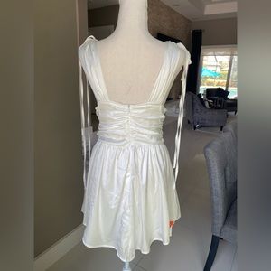 White silky mini low v dress
